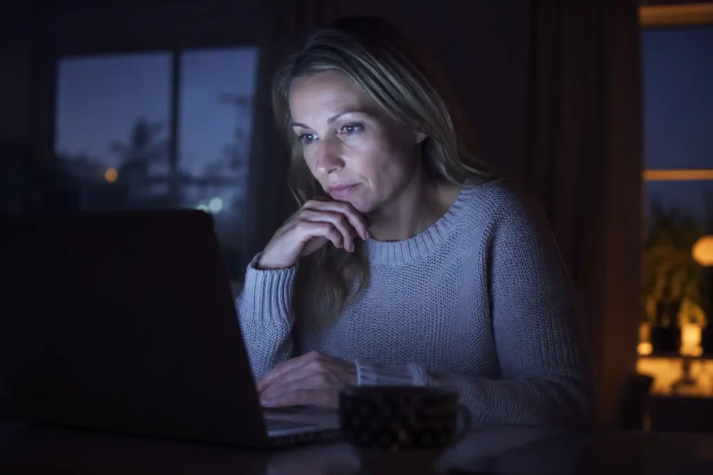 A UK player cautiously exploring a newly launched Skrill casino at night