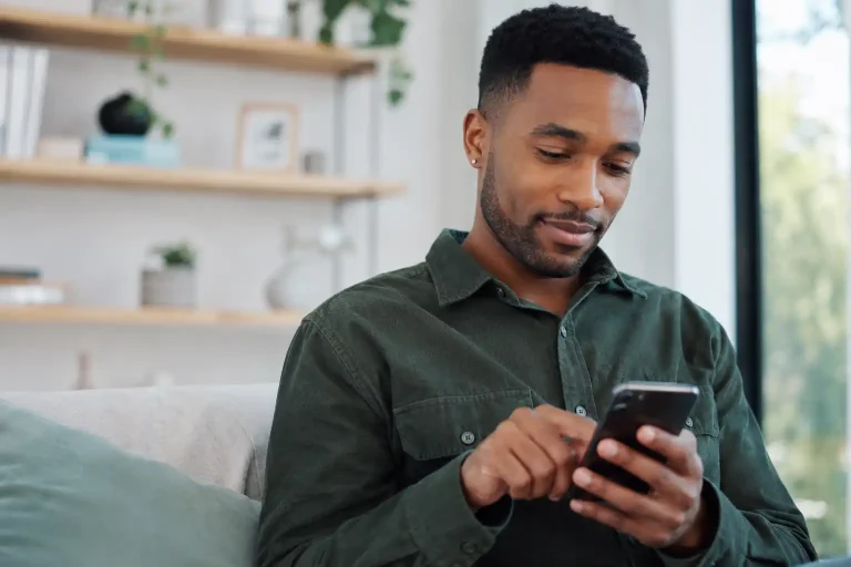A UK player making a casino payment on a modern smartphone