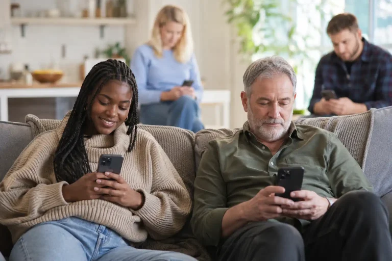 A diverse mix of UK adults using smartphones to play at online casinos